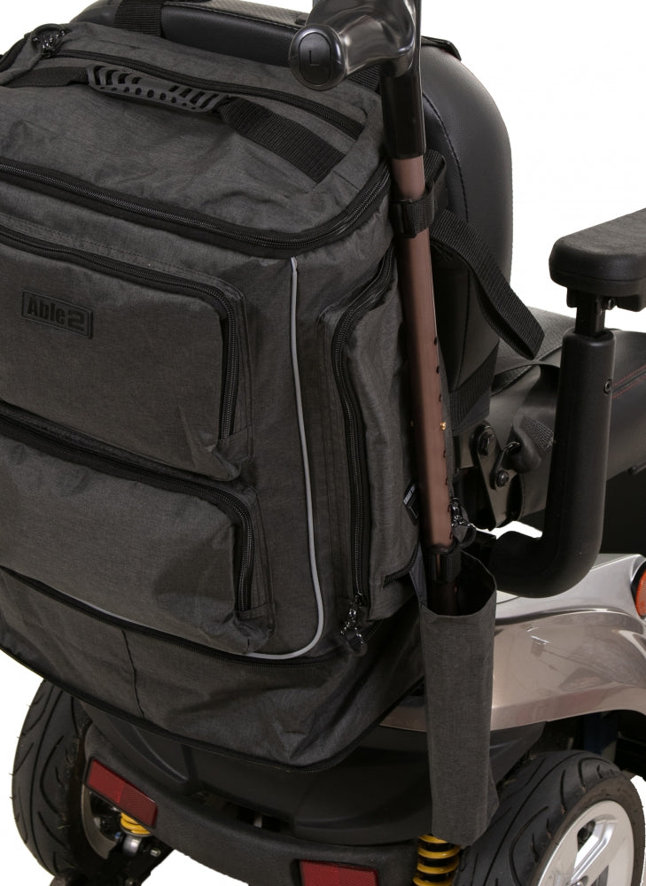 shows a close-up of the Torba Luxe Premium Mobility Scooter and Wheelchair Bag with a crutch in the side pocket