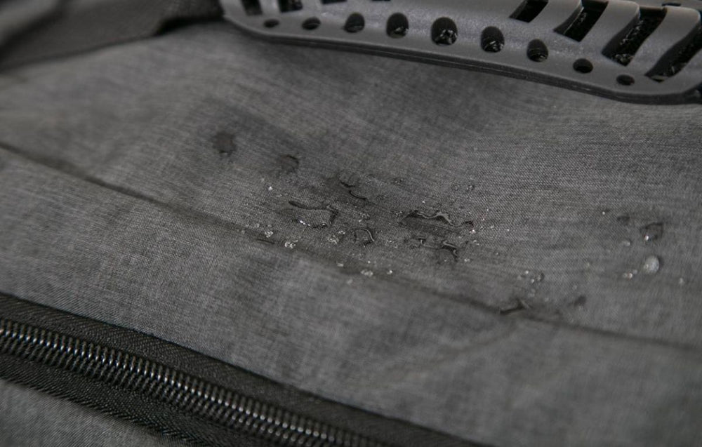 Image of water droplets on the torba go fabric bag, showing how waterproof it is