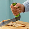 the image shows the Easi-Grip kitchen carving knife being used to carve meat