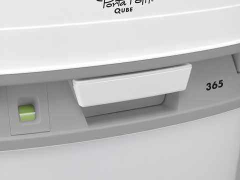 shows a close up of the handle of a porta potti 365 portable flushing toilet