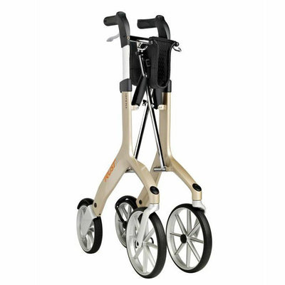 shows a folded up lets fly champagne coloured rollator