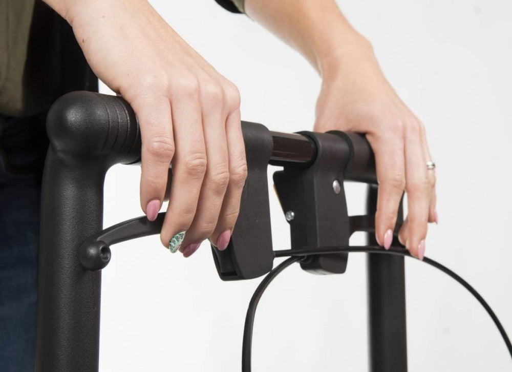 shows someone using the brakes on the carlett shopping rollator