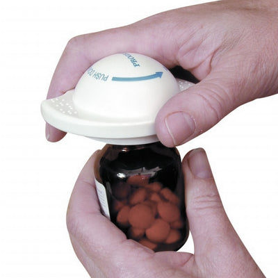 Someone using the Multi-Grip to open the lid of a pill bottle
