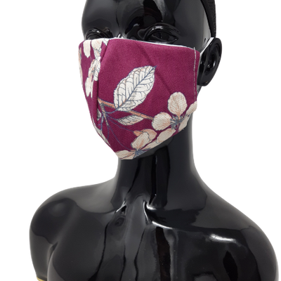 shows the washable reusable face mask in purple with flowers design