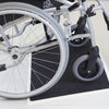 the image shows a wheelchair using a fibreglass threshold ramp