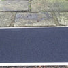 the image shows the fibreglass threshold ramp being used next to a step
