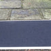 the image shows the fibreglass threshold ramp being used next to a step