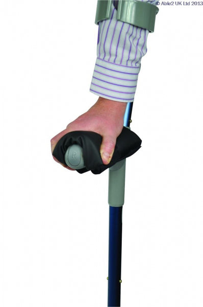 shows someone using a Harley Crutch Comfort Pad on a crutch handle