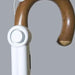the image shows the mobility and toileting aid alarm attached to a wooden walking stick / cane