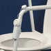 the image shows the mobility and toileting aid alarm attached to a toilet frame