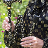 the image shows a woman holding the classic canes folding fashion derby cane with the swallows pattern 