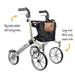 A Black & Silver Let's Go Out Rollator with the text: Adjustable with locking brakes, Large front wheels easily mount curbs.