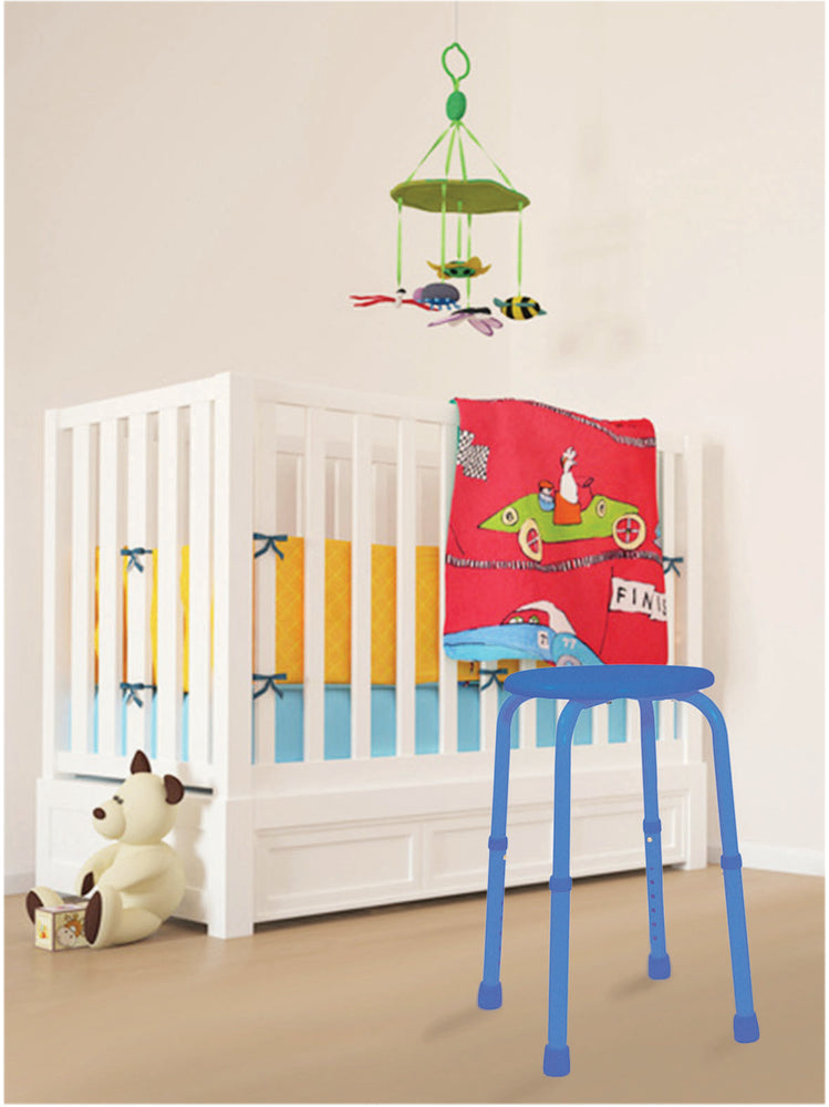 shows a blue multi-purpose adjustable stool in a baby's nursery beside a white cot