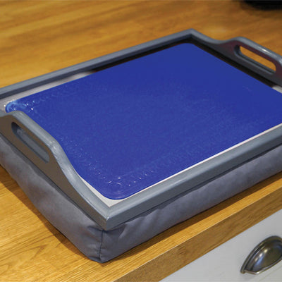 shows a blue anti slip silicone mat on a tray, on a table