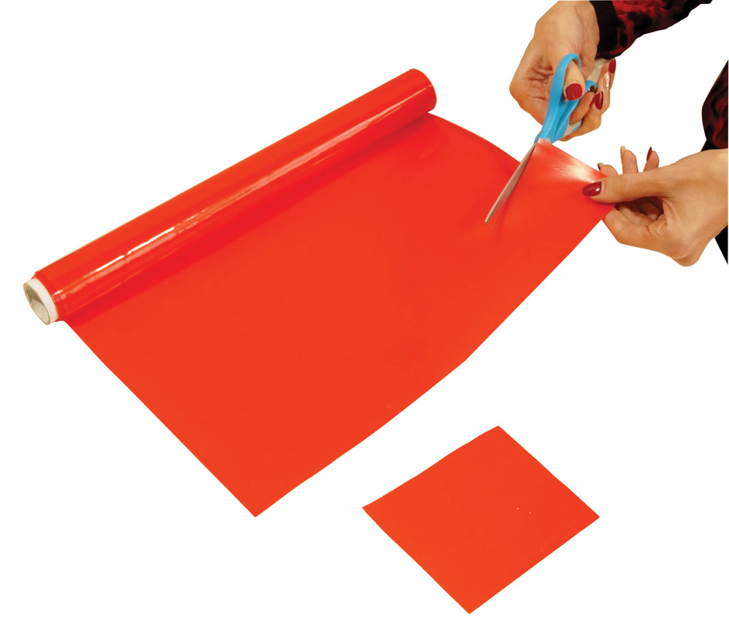 shows someone cutting a bit of the non slip silicone roll