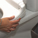 shows a close up of how to fit and release the e'loo one touch toilet seat