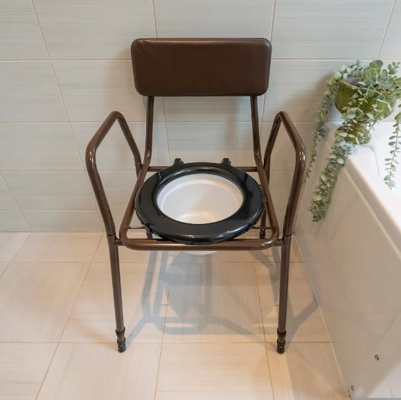 Stackable commode chair in bathroom with lid off and commode in