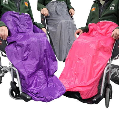 The three different colours of wheelchair cosy, purple, grey and pink