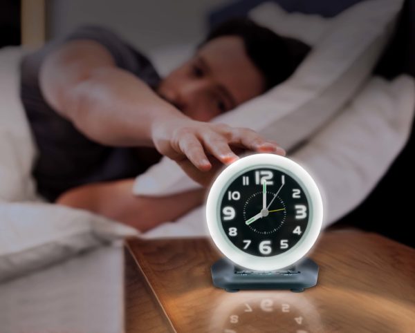 Man waking to wake n shake clock