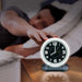 Man waking to wake n shake clock