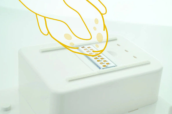 A diagram showing how the Food Workstation can be used to grate something