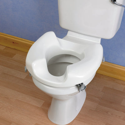 shows the ashby wide access raised toilet seat on a toilet