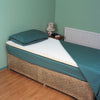 shows the mattress topper on a single bed