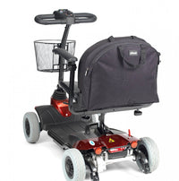 shows the large backpack scooter bag fixed to the back of a mobility scooter