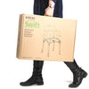 The image shows a boxed up Etac Swift Shower Chair