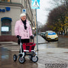 A person using a Trionic Walker Rollator 9