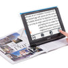 shows someone using the compact 10 hd magnifier to read a magazine