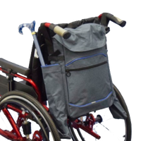 shows the Crutch/Stick Holder Bag for Wheelchairs attached to a wheelchair with a folding cane / walking stick in one of the side pockets