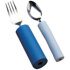 shows the dark blue cylindrical foam padding holding a fork and the light blue cylindrical foam padding holding a spoon