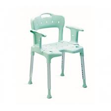 The image shows a green Etac Swift Shower Chair