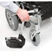 shows a person's hand moving the adjustable, swing-away footrests on the Cirrus Powerchair