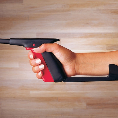 the image shows a close up photo of someone holding an Etac Aktiv Reacher with Power Grip and Hook