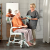 the image shows a person using an Etac Clean Shower Commode Chair