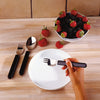 shows the Etav Light Combination Cutlery being used to eat some strawberries
