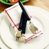 shows the Etac Light Combination Cutlery resting on a napkin on a plate