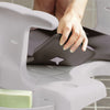 the image shows the etac swift seat cushion being attached to an etac swift