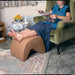 shows someone using the tuffet leg rest