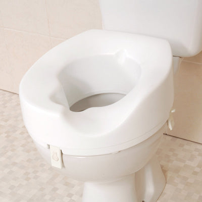 shows the melton sloped raised toilet seat, on a toilet.
