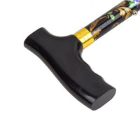 the image shows a close up of the handle on the folding patterned walking stick