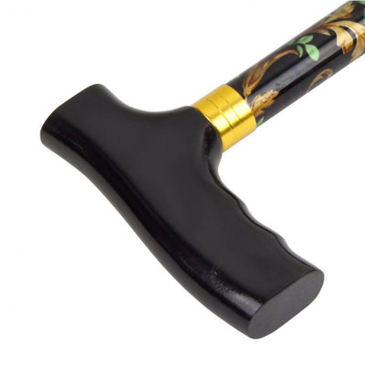 the image shows a close up of the handle on the folding patterned walking stick