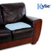 The image shows the blue Kylie Chair Pad on a settee