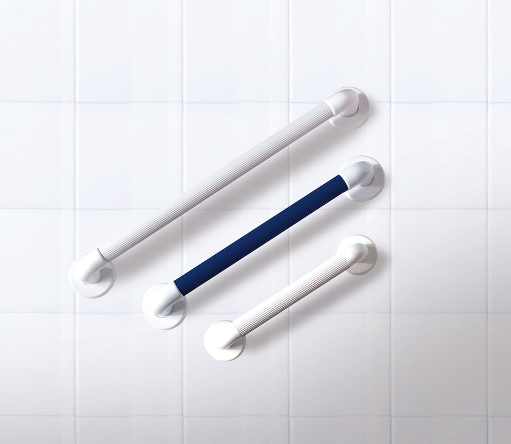 shows white and blue plastic fluted grab rails against a white tiled background