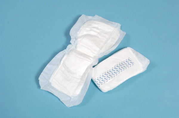 The image shows one Lil Supreme Light Shaped Incontinence Pad opened out and one pad folded over