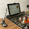 the image shows the lifemax hands free mobile device mount in use beside a kitchen hob