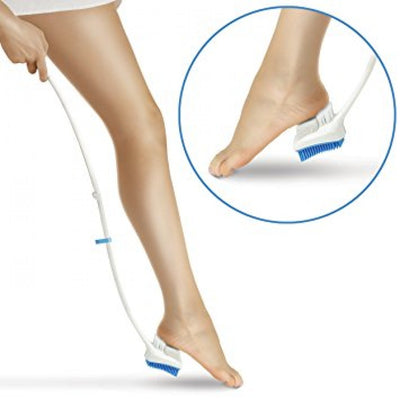 The image shows the Long Handled Pedicure Brush in use.