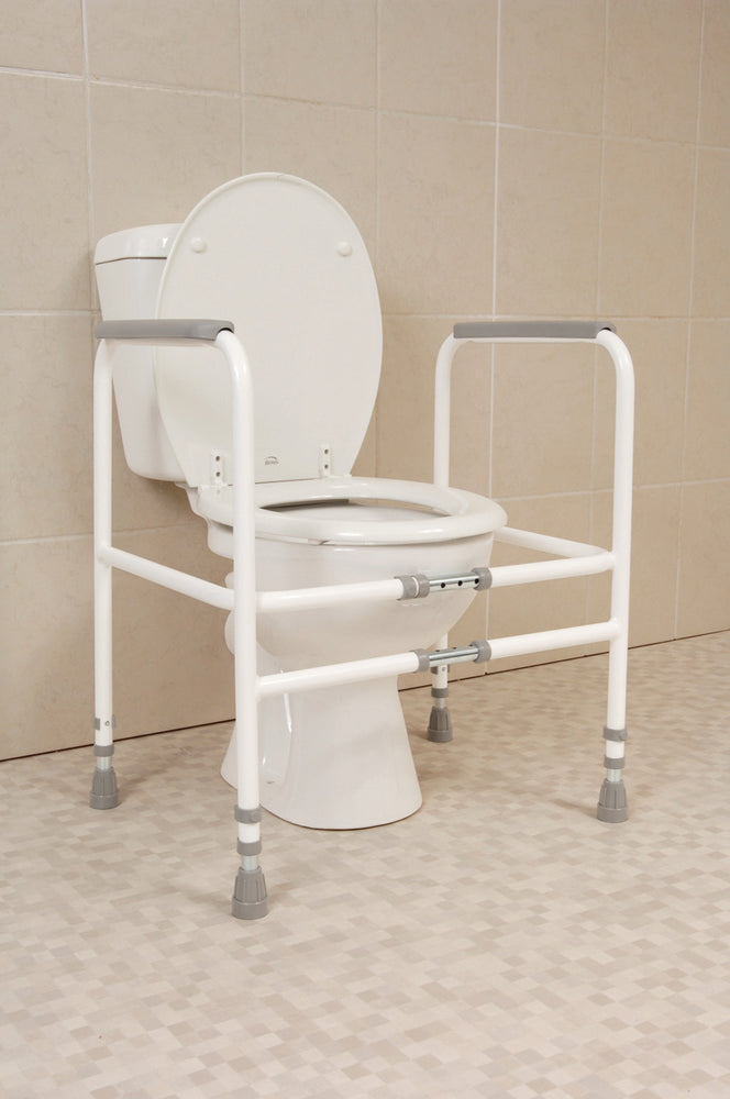 the image shows the height and width adjustable toilet fram around a toilet in a bathroom